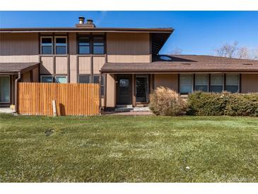 Charming townhome featuring a well-maintained lawn and a cozy, covered front entry at 3742 S Granby Way, Aurora, CO 80014