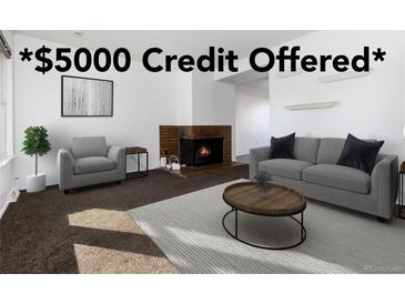 Bright living room featuring stylish furniture, a cozy fireplace, and a *$5000 credit offered* at 3742 S Granby Way, Aurora, CO 80014