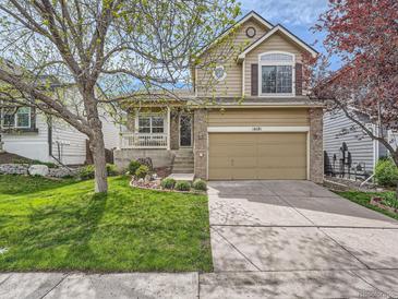 Charming two-story home with a well-maintained lawn and inviting curb appeal in a neighborhood setting at 16181 White Hawk Dr, Parker, CO 80134