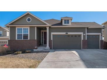 Charming two-story home featuring a three-car garage, brick accents, and well-maintained landscaping at 2906 E 163Rd Ave, Thornton, CO 80602