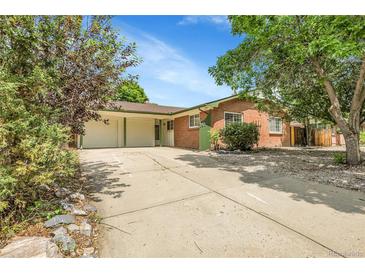 Charming single-story brick home with a spacious driveway and a two-car garage at 797 W Briarwood Ave, Littleton, CO 80120