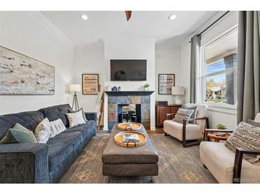 Bright living room featuring a fireplace and neutral decor at 2955 N Columbine St, Denver, CO 80205