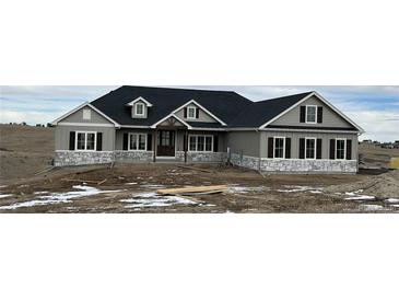 Charming single-Gathering home featuring stone accents and a classic design, set against a natural landscape at 270 High Meadows Loop, Elizabeth, CO 80107