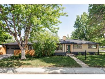 Charming brick ranch-style home with mature trees, a landscaped front yard, and a welcoming entrance at 1695 E Eastman Ave, Englewood, CO 80113