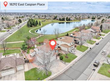 Beautiful aerial view of the home, lake, and neighborhood at 18292 E Caspian Pl, Aurora, CO 80013