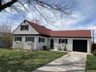 Charming single Gathering home with a well manicured lawn, red roof, black shutters, and a one car garage at 2725 S Monroe St, Denver, CO 80210