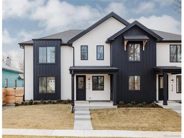 Modern two-story home with black and white accents, large windows, and a well-manicured front yard at 4135 Benton Street, Denver, CO 80212