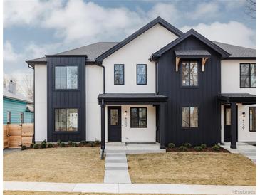 Modern home boasts a striking black and white exterior and manicured lawn at 4135 Benton Street, Denver, CO 80212