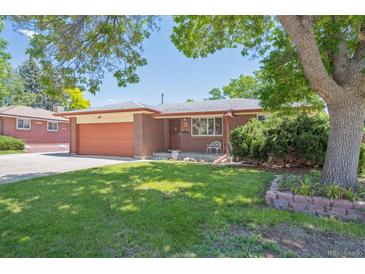 Charming single-story brick home with a well-maintained lawn and mature landscaping at 1774 S Dover Way, Lakewood, CO 80232