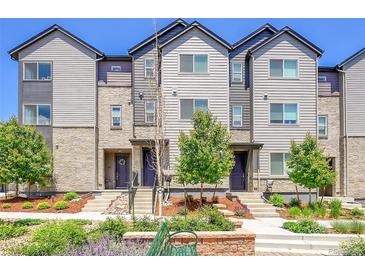 Attractive townhome exterior with landscaping, hardiplank, and stone detailing at 5387 Pierson Ct, Wheat Ridge, CO 80033