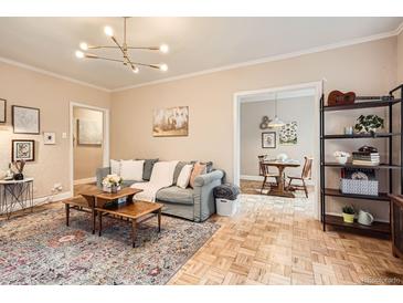 Inviting living room with stylish decor, comfortable seating, and hardwood floors at 963 N Logan St # 11, Denver, CO 80203