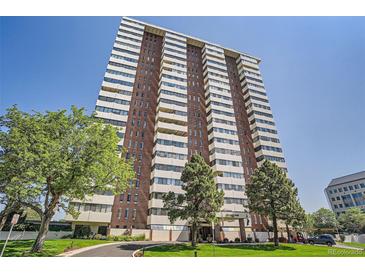 View of the Polo Club condominium building showcasing the architecture and landscaping at 3131 E Alameda Ave # 1503, Denver, CO 80209