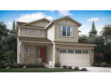 Charming two-story home featuring stone accents, a covered porch, and a two-car garage at 686 N Clubview St, Watkins, CO 80137