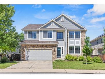 Charming two-story home with a two car garage and stone and siding exterior at 15021 Josephine St, Thornton, CO 80602