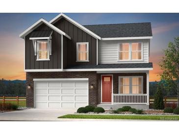 Charming two-story home with a brick facade, white garage door, and a welcoming red front door at 3331 N Buchanan Way, Aurora, CO 80019