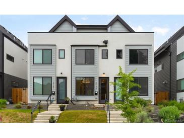 Modern townhome featuring a sleek exterior design, well-maintained landscaping, and inviting entryway at 2179 S Bannock St, Denver, CO 80223