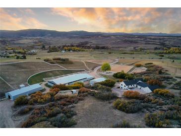 Expansive horse property featuring a large barn, riding arena and luxurious home in a picturesque landscape at 810 N Perry Park Rd, Sedalia, CO 80135
