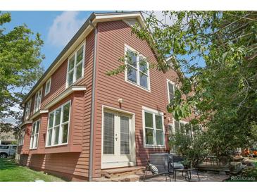 Inviting exterior featuring well-maintained siding, multiple windows, and a cozy patio set at 4632 14Th St, Boulder, CO 80304