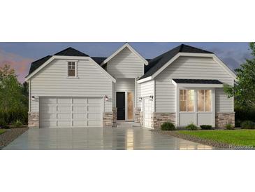 Charming home with a two-car garage and stone accents at 16500 Black Rose Cir, Parker, CO 80134