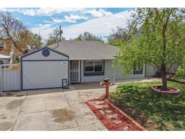 Charming one-story home featuring a well-maintained lawn and a unique pathway to the front door at 948 S Tennyson St, Denver, CO 80219