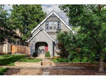 Charming home with a gray exterior, landscaped front yard, and inviting front porch at 424 N Clarkson St, Denver, CO 80218