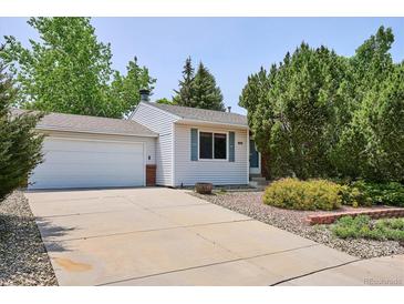 Charming single-story home with a well-maintained front yard and attached garage at 800 Park View Pl, Castle Rock, CO 80104