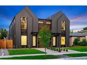 Modern two-story homes feature striking dark wood siding, professional landscaping, and inviting front entrances at 2478 S Cherokee St, Denver, CO 80223