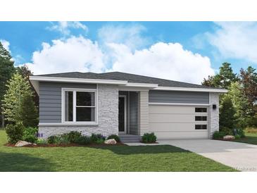 Charming single-story home featuring stone accents, a two-car garage, and well-manicured lawn at 8241 Rockvale Dr, Littleton, CO 80125