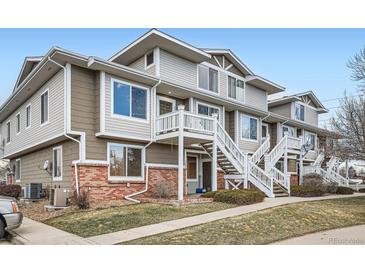 Inviting townhouse with a quaint staircase and charming combination of brick and siding at 9139 W 50Th Ln # 204, Arvada, CO 80002