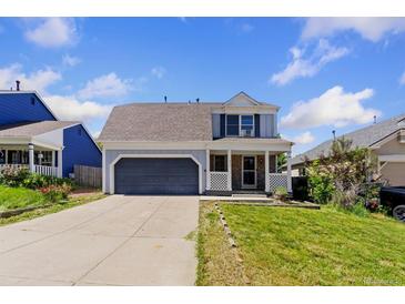 Charming two-story home with a well-maintained lawn and a two-car garage, perfect for suburban living at 9844 Fairwood St, Littleton, CO 80125