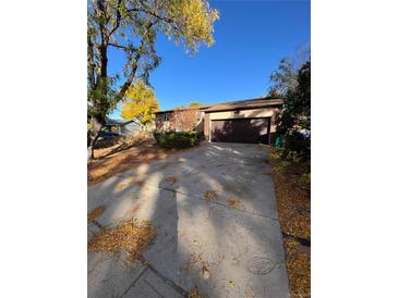 Ranch style home with attached garage and driveway, needs landscaping at 3246 S Nucla St, Aurora, CO 80013