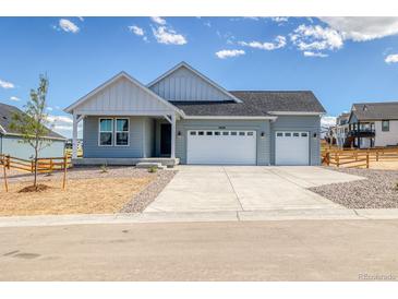 Charming single-Gathering home featuring a two-car garage and stylish architectural details at 39628 Yorktown Ter, Elizabeth, CO 80107