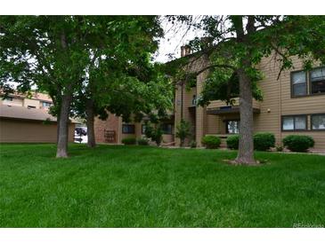 Multi-Gathering building with green space and mature trees provides a peaceful, park-like setting at 400 Zang St # 1-105, Lakewood, CO 80228