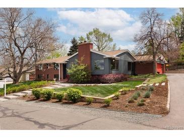 Charming single-Gathering home featuring a well-manicured lawn and a combination of brick and siding exterior at 26 Morningside Dr, Wheat Ridge, CO 80215