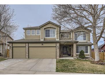 Inviting two-story home with a three-car garage and well-maintained lawn at 1525 E 133Rd Ave, Thornton, CO 80241