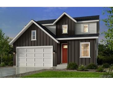 New two-story home featuring vertical siding, a two-car garage and a red front door at 13333 Blue Amber Ct, Parker, CO 80134