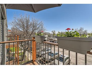 A cozy balcony with flower boxes adds charm to the outdoor space at 16259 W 10Th Ave # J5, Golden, CO 80401