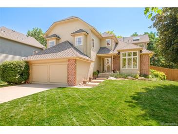 Charming two-story home featuring a well-manicured lawn and attached two car garage in a desirable location at 16438 E Prentice Cir, Centennial, CO 80015