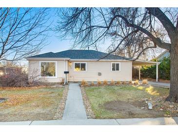 Charming single-story home with a welcoming walkway and a convenient carport at 1050 Uvalda St, Aurora, CO 80011