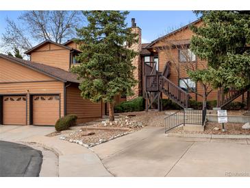 Inviting exterior showcasing a two-story home with natural landscaping and private parking at 9409 W 89Th Cir, Broomfield, CO 80021