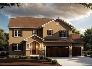 Stunning two-story home with a three-car garage and well-manicured landscaping at 941 Saint Andrews Ln, Louisville, CO 80027