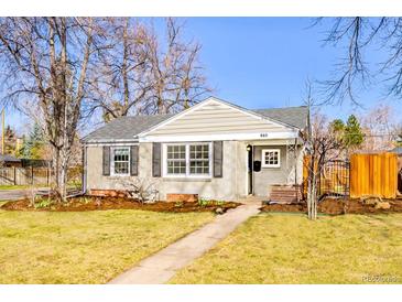 Charming single-story home with neat landscaping, well-maintained lawn, and inviting curb appeal at 860 Magnolia St, Denver, CO 80220