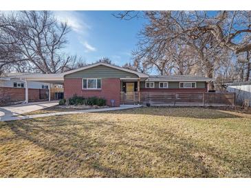 Charming brick home with a well-maintained lawn and inviting curb appeal on a sunny day at 1004 W Shepperd Ave, Littleton, CO 80120