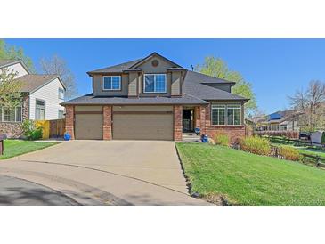 Charming two-story home with a well-maintained lawn and an attached two-car garage, perfect for Gathering living at 10127 W 100Th Ct, Westminster, CO 80021