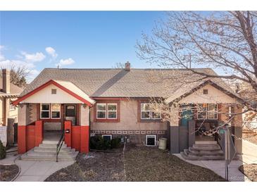 Charming brick duplex with inviting front porches and well-maintained landscaping at 1556 Osceola St, Denver, CO 80204