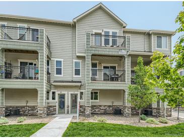 Modern 2-story townhome with balconies and landscaped grounds at 11250 Florence St # 28E, Commerce City, CO 80640