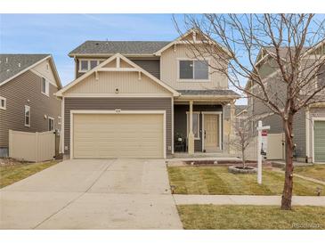 Charming two-story home with a two car garage and well-maintained front yard at 4574 Walden St, Denver, CO 80249