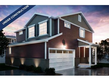 New construction home featuring a two-car garage, welcoming porch, and craftsman-style details at 22392 E 38Th Pl, Aurora, CO 80019