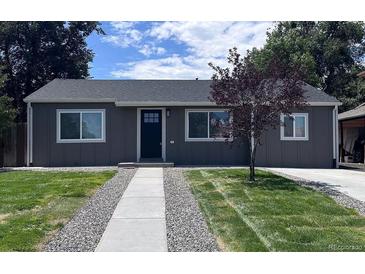 Charming single-story home with a well-manicured lawn and fresh landscaping at 1455 S Tennyson St, Denver, CO 80219