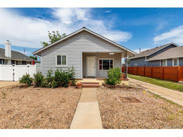 Charming single-story home with gravel front yard and inviting walkway to the front door at 436 S 4Th Ave, Brighton, CO 80601